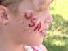 Alabama: niños darán vida a la historia en Huntsville Niña con pintura facial patriótica durante actividades previas al desfile histórico de Huntsville en Alabama.