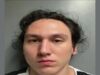 Apuñalamiento en Albertville deja un acusado de intento de homicidio Retrato policial de frente de Nicholas Trombetta, joven con cabello oscuro revuelto, tras su detención.