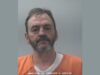 Arresto en Huntsville tras persecución por robo con cuchillo Fotografía de arresto de Jimmy Lewis Price Jr con uniforme naranja en la oficina del sheriff de Madison.